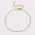Detail of golden stainless steel anklet with blue beads, lobster clasp and extender - Light Blue