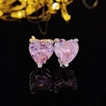 Macro shot of heart-cut purple gemstone studs with silver metal base and reflection - Heart Pink Style (E4877)