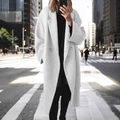 Women's long double-breasted grey wool coat with lapels shown in an urban street setting - S / Off-white