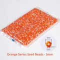 Mix of 3mm orange and white glass seed beads for DIY jewelry and embroidery crafts - Orange Tones Mixed 3mm