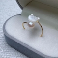 Cat-shaped shell pearl ring in gold finish with textured band in a jewelry box - White Cat Shell