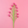 Detailed close-up of a handmade crochet flower with pink buds and green yarn stem - Sheng Tang - Snow Fruit Bouquet (rose Red)
