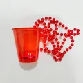 Red glowing party shot glass with macaron bead chain for festive wedding celebrations - Transparent Red LED Glow Cup