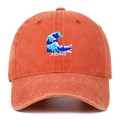 Close-up of wave embroidery and Japanese characters on washed cotton baseball cap - Orange