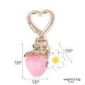 Pink glitter strawberry keychain with a white daisy and golden heart-shaped clasp - K00869-03 Pink Glitter Strawberry with Daisy