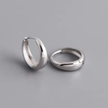 Detailed macro view of S925 sterling silver wide hoop earrings with a clasp closure - Inner Diameter 12mm / White Gold