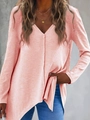 Close-up of coral pink V-neck knit sweater featuring waffle texture and side slit hem - S / Tops / Pink
