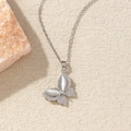 Elegant silver butterfly necklace with cat-eye stones and pavé crystals on a soft background - BXL0256-5 Silver White Cat's Eye Butterfly