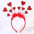 Detail of red sequin heart headband featuring vibrant glitter and soft feather trimming - 10 Hearts + Feather Style