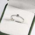 Close-up of a silver Z letter adjustable ring with micro-pave crystals in a green box - Platinum Z