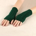 Detail of dark green cable knit fingerless gloves showing thick twist pattern texture - One Size / Dark Green
