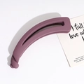 Detailed close-up of a matte purple twisted banana clip hair accessory on a white background - Purple