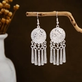 Bohemian silver leaf tassel earrings with floral relief on vintage wood display - Silver Relief Disc Five Column Tassel Style (E2873-13)