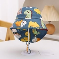 Detail of kids sun hat with colorful dinosaur print and adjustable chin strap - Dark Blue Sunny Day Dinosaur