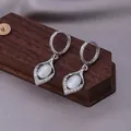 Silver leaf drop earrings with white cat eye stone and pave crystals in variant finish - E-035---Platinum