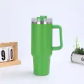 Close-up of green 40oz insulated tumbler with ergonomic handle and straw lid - Green (Generation 1)