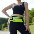 Outdoor runner wearing neon green running belt with reflective strip and earphone hole - Fluorescent Green