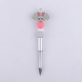 Close-up of a DIY beaded pen featuring a grey silicone bat charm and pastel colored beads - Grey Bat