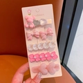 Close-up of pink rhinestone pearl hair clip set featuring bow and bear designs - Shell 5-piece Set