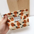 Floral corduroy makeup bag in beige with orange flower patterns and zip closure - Small / Orange Flower