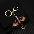 Vintage dragon keychain with colorful enamel and sparkling rhinestones on black background - Red