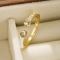 Gold plated open ring with white enamel and heart-shaped zirconias on a jewelry box - Heart White Enamel (13239) / White