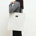 Polka dot canvas tote bag with black shoulder strap and minimalist Shopping label - Black and White Dot