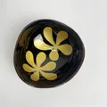 Handcrafted coconut shell bowl with black lacquer and gold floral pattern inside - Yellow Petal Style
