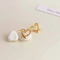 Detailed macro view of minimalist hollow heart-shaped 18K gold plated stud earrings - 18K Gold Plated Golden Hollow Heart Earrings