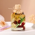 Reed diffuser in glass bottle with dried red roses and yellow flowers on a white plate - 100ml-Shangri-La