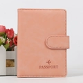 Pink orange RFID blocking passport holder with magnetic buckle and airplane debossing - Pink