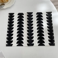 Close-up of geometric black semi-circle pattern on a minimalist fabric placemat - Black Semicircle
