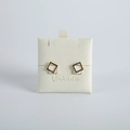 Detail of geometric double square gold stud earrings with white enamel on display card - 6*6cm / Off White