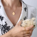 Elegant 18k gold plated stainless steel necklace with oval floral pendant on female model - January Flower(P1142) / 40cm+5cm / Gold
