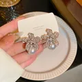 Elegant gold flower earrings with micro-paved crystals and white pearl drops for women - 925 Silver Needle Full Diamond Five-petal Flower Pearl Pendant Earrings
