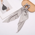Detail of elegant grey silk satin hair scrunchie with long ribbons on white background - Gray