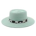 Detailed texture of mint green boater straw hat with cow print ribbon and silver buckle - M (56-58cm) / Mint Green