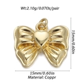 Macro view of a 15mm gold bow pendant with heart center made of polished copper - Heart Gold Bow (YSN007-09)