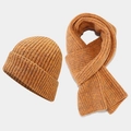 Detail of thick ribbed knit texture on ginger yellow winter beanie and scarf set - Orange