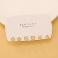 Detailed view of geometric stud earring set with gold frames and amber resin stones - 93 KC Gold (H-152)