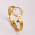 Golden titanium steel sunflower bangle with crystals and blue evil eye charm - Sun Disk Style