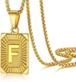 Close-up of gold F-letter rectangular pendant with textured rays on a box chain - Letter F