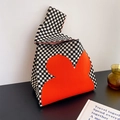 Knitted checkerboard handbag in black and white with a red floral design - Beige-Black