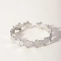 Detailed macro view of silver floral pattern stainless steel open cuff bracelet - Silver Daisy Style (5-DQ-001)