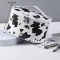 Portable waterproof large capacity makeup bag in beige color with detailed dimensions - X-183-10 Oval Shape/Black White Cow Pattern