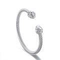 Silver twisted cable open cuff bracelet with vintage engraved ball end caps on white background - Steel