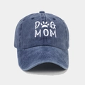 Detailed close-up of Dog Mom embroidery and vintage washed cotton texture on baseball cap - Adjustable / Navy Blue