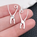 Pair of miniature silver alloy pliers pendants for jewelry making on a fingertip - 10x23mm 0.5g