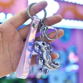 Dettaglio del portachiavi a dinosauro in metallo argento con cinturino rosa trasparente - Cinturino da polso + Dinosauro / Viola
