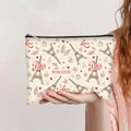 Paris themed canvas makeup bag held by a person showing the Eiffel Tower print - Paris Love Coffee Style (jiayingpbb0259)